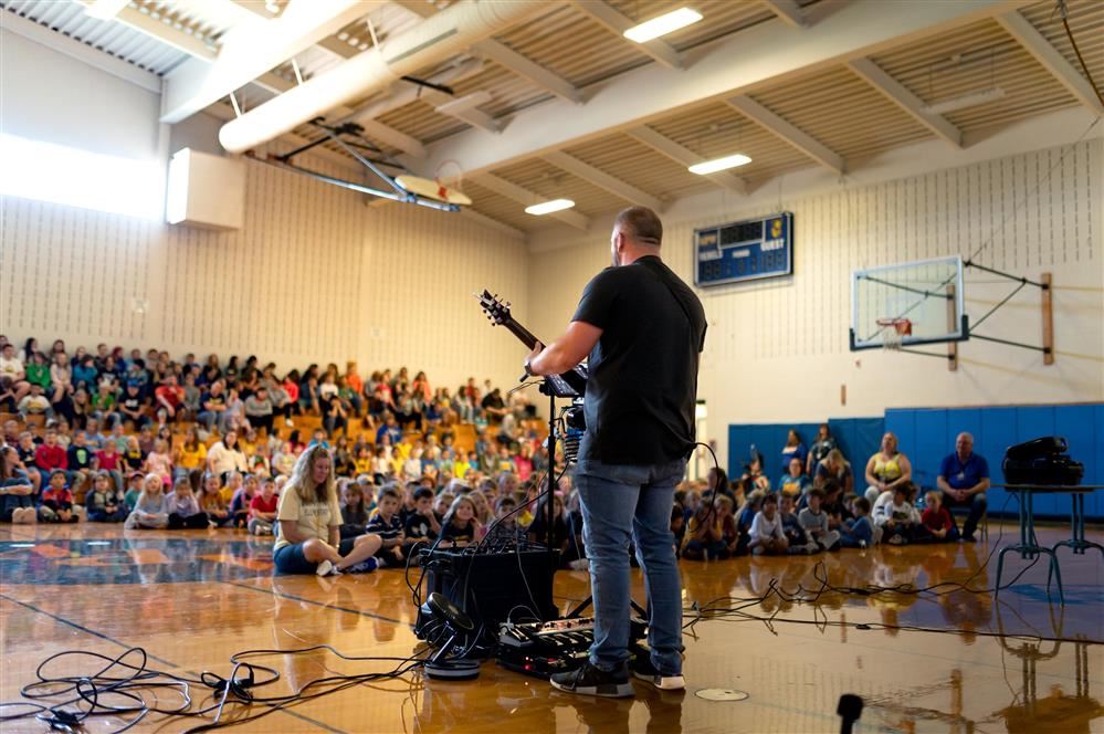 Jared Campbell performs in front of a packed auditorium at the APW Elementary School